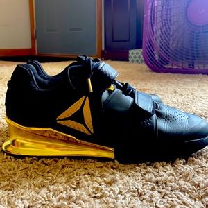 Gold and Black size 9 Reebok lifters